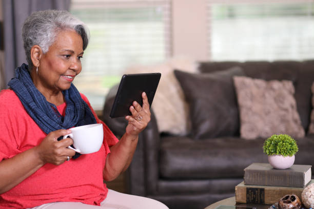 istock Senior adult woman at home using digital tablet. 1367409468