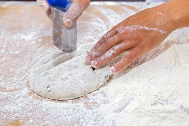 istock Baker molding wholemeal flour breads for baking 1367413721