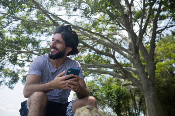istock Young man at a park on a beautiful sunny day 1367415693