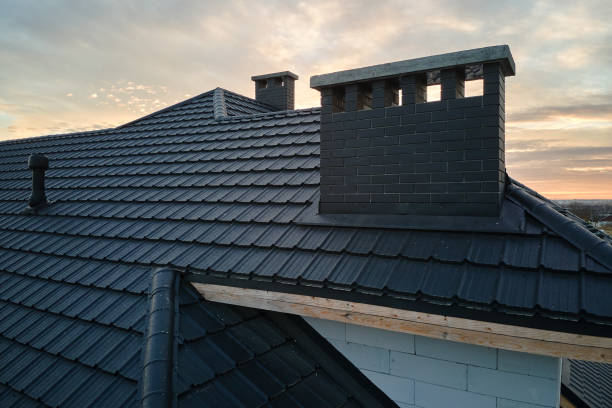 Closeup of brick chimney on house roof top covered with ceramic shingles. Tiled covering of building Closeup of brick chimney on house roof top covered with ceramic shingles. Tiled covering of building. modern roof stock pictures, royalty-free photos & images