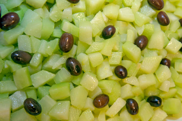 Closeup of salad platter of chayote and olives Closeup of salad platter of chayote and olives, in self-service restaurant. Sao Paulo state, Brazil. Christophine stock pictures, royalty-free photos & images