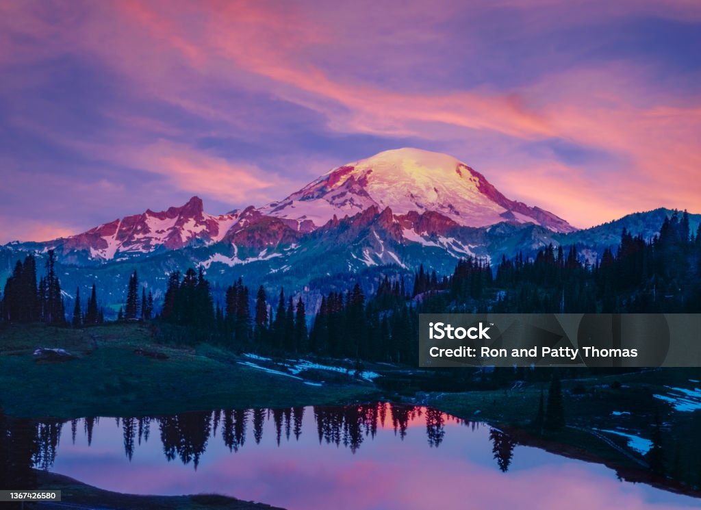 Spring morning in the Cascade Range with reflection of Mount Rainier, WA Glowing sunrise morning with reflection of Mount Rainier Mt Rainier Stock Photo