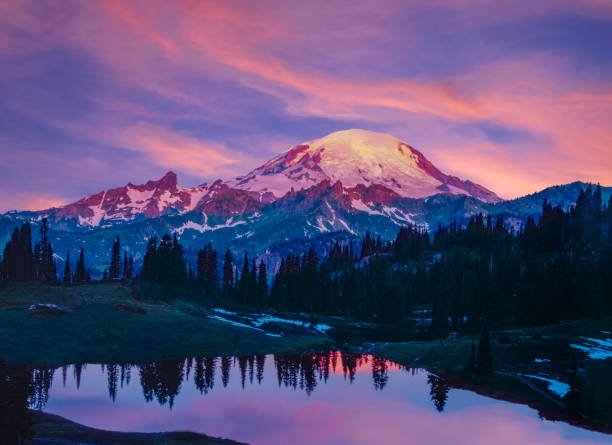Spring morning in the Cascade Range with reflection of Mount Rainier, WA Glowing sunrise morning with reflection of Mount Rainier mt rainier stock pictures, royalty-free photos & images
