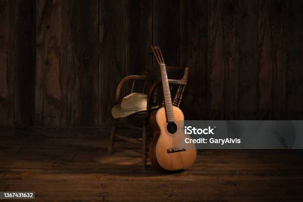 Barn Wood Background With Chair Guitar And Cowboy Hat Stock Photo - Download Image Now