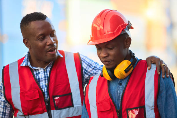 istock Two African colleagues chatting intimately. 1367434190