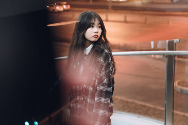 istock Young Asian women at night 1367435194