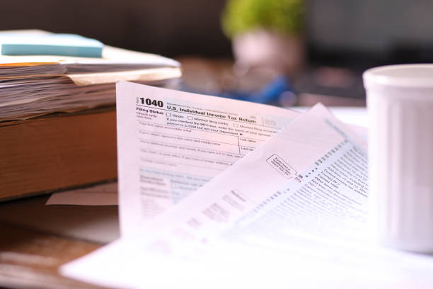 istock Tax: USA Income Tax forms and supporting preparation materials. 1367439481