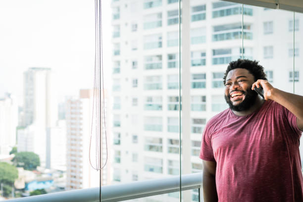istock Cheerful, a man talks on the phone 1367441047