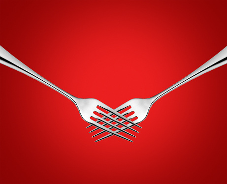 Happy Valentine's Day Concept. Valentine restaurant of food brand concept. Two fork symbol of hand visualize the love or valentine concept.