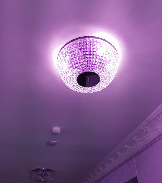istock Luxury crystal chandelier on the ceiling with tinted Very Peri 1367446669