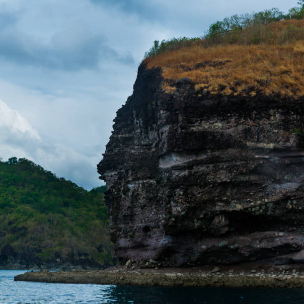 istock Rock Island over scenic blue sea water. 1367446786