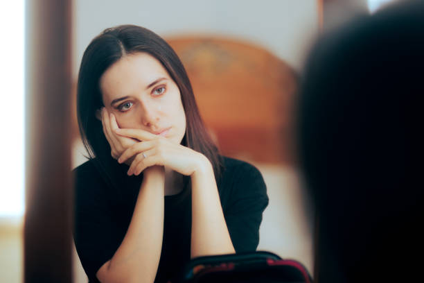 Sad Depressed Woman Crying Looking in the Mirror Sorrowful and anxious insecure adult person suffering a crisis meltdown low self esteem stock pictures, royalty-free photos & images