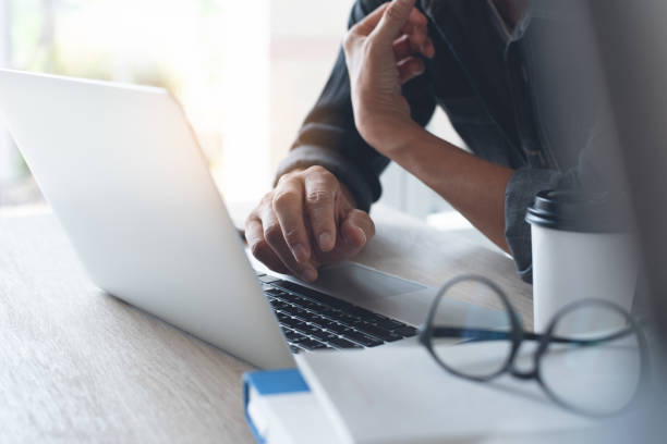 istock Businessman working on laptop computer from home 1367451170