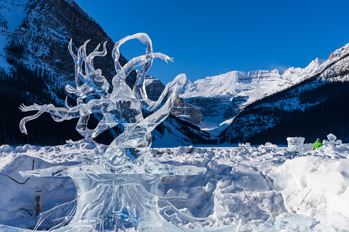 Lake Louise, Alberta, Canada - January 27 2022 : Fairmont Chateau Lake Louise Ice Magic Winter Festival ice carving.