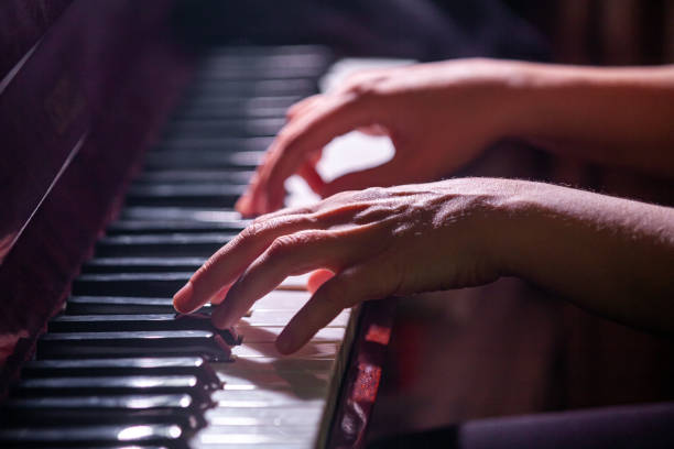 istock Pianist's fingers on a keyboard 1367460790