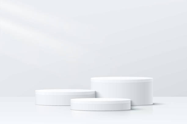 istock Abstract white and gray 3D room with set of realistic white cylinder pedestal podium. Minimal scene for product display presentation. Geometric platform design. Stage for showcase. Vector llustration 1367460854