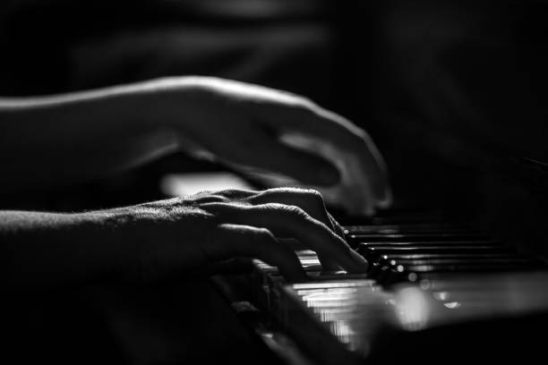 istock Pianist's fingers on a keyboard 1367461438