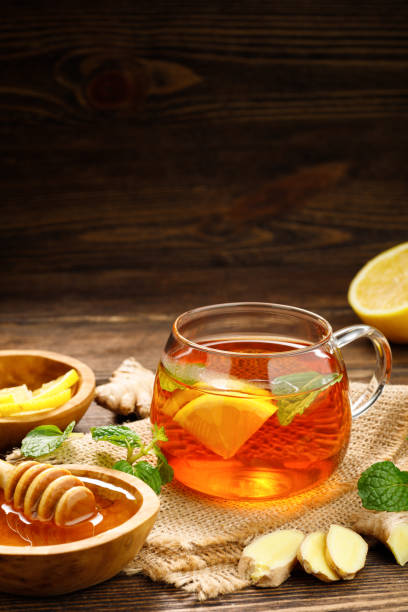istock A glass cup of hot tea with lemon, mint and ginger. 1367462794
