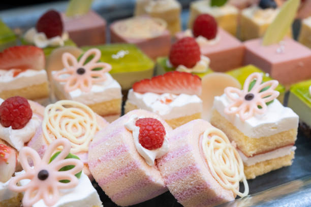 istock A lot of pink roll cakes and small cakes 1367466503