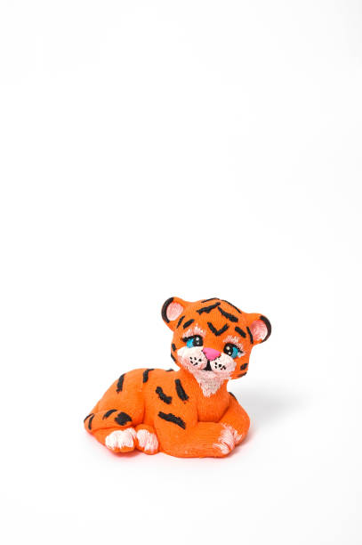istock little tiger cub made of chocolate on white background 1367466642