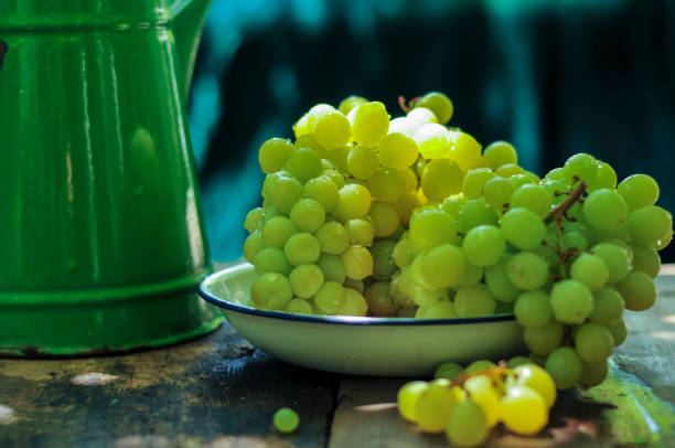 Ripe white grape in an enamel bowl