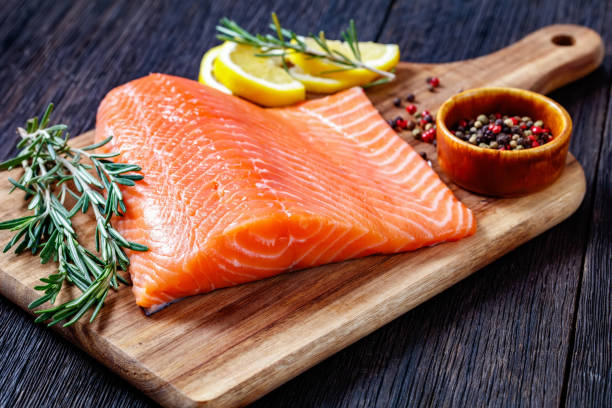 istock Fresh salmon fish fillet on wooden board 1367472154