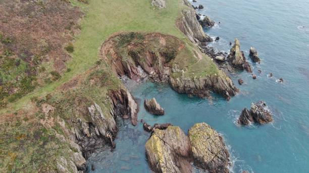 istock Drone Birdseye View of Rugged Jagged Devon Coastline and Cliffs 1367475674