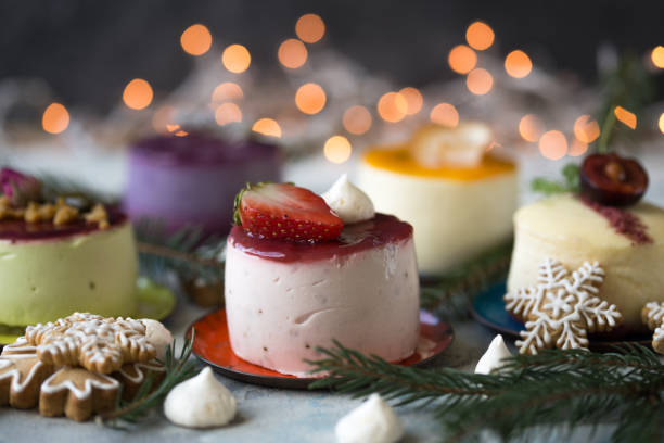 istock Mini cheesecake with blueberry, blackberry and strawberry ready to be served on light  table 1367478444