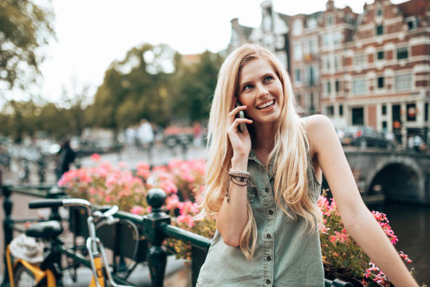 istock woman on the phone in amsterdam 1367479251