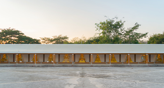 Row of buddha statues. Wat Dhammayan temple, Phetchabun. Famous tourist attraction landmark. Thai History architecture.