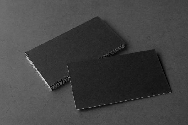 istock Business card on black background. 1367481859