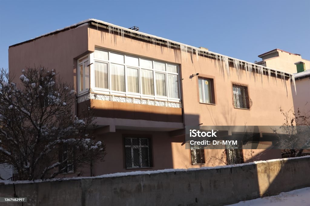Roof ice dams. Common view during winter. 
Cold weather -50 degrees Celsius.
Erzurum in Turkey.
snow, icing, freezing, frozen, ice Asia Stock Photo