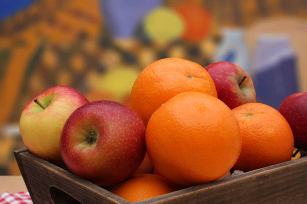 Apples and oranges in a wooden basket  Buffet dessert