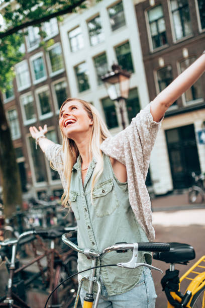 istock happiness woman with arm raised 1367484074