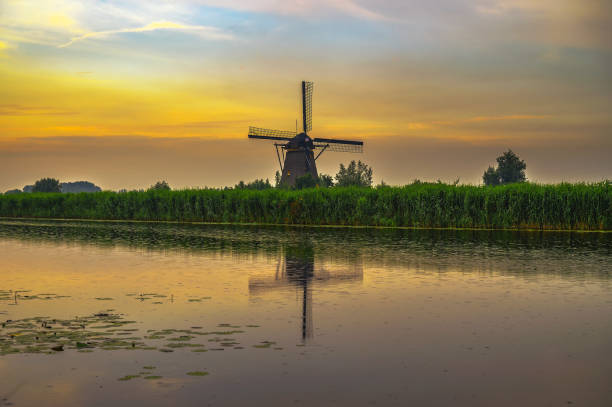 istock Old dutch windmill at sunset in Kinderdijk, Netherlands 1367486951