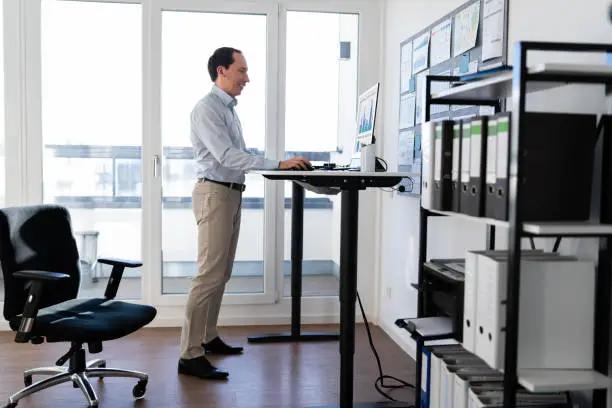 Photo of Adjustable Height Desk Stand In Office