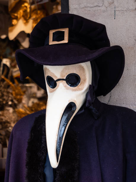 Plague Doctor Mask in Venice Venetian Bubonic Plague Doctor Mask with Beak and Costume in Venice, Italy black plague doctor stock pictures, royalty-free photos & images