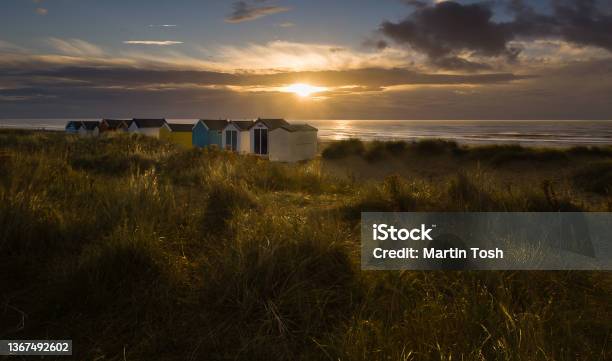 Sunrise Over Beach Huts And Dunes At Southwold Beach Suffolk I Stock Photo - Download Image Now