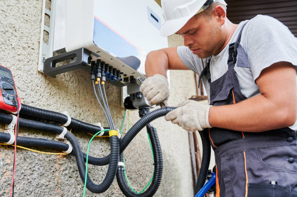 electrician installing solar panel system, wiring inverter and electric box - solar panel engineer solar power station solar energy imagens e fotografias de stock