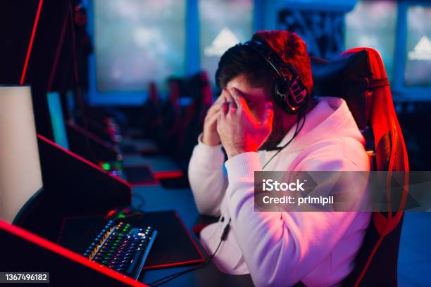Guy Playing Gaming Game On Computer At Game Club Stock Photo - Download Image Now - Gamer, 20-24 Years, Adult
