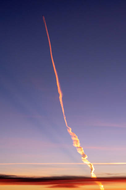 istock airplane flying over a blue sky in an afternoon 1367497318