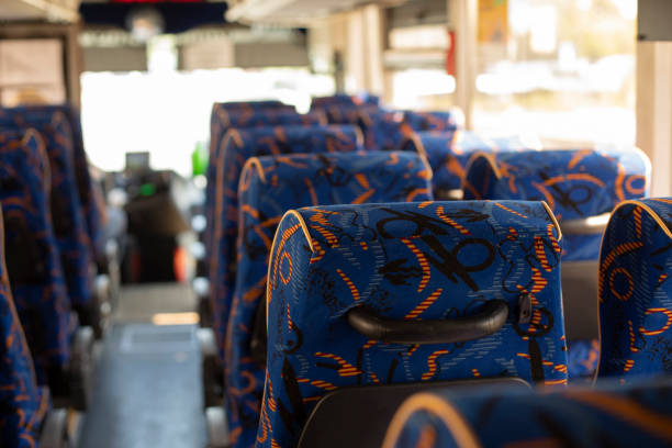 istock Interior of bus. Seating in transport. Seats for passengers. 1367499251