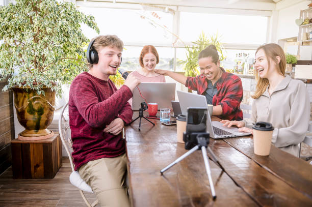 istock Happy multi ethnic friends sharing content on streaming platform - Group of diverse friends having fun doing live on social media - smart millennial, blogger, communication concept 1367500334
