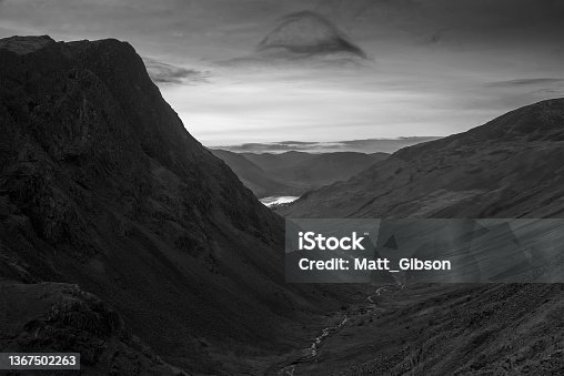 istock Black and white Stunning colorful landscape image of view down Honister Pass to Buttermere from Dale Head in Lake District during Autumn sunset 1367502263