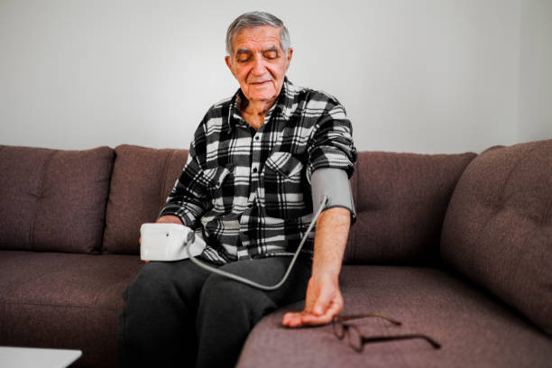 istock Senior man measuring his blood pressure 1367502364