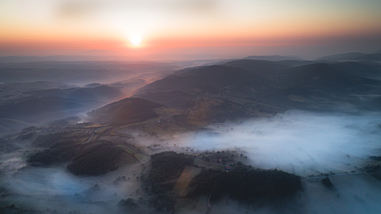 Beautiful arial landscape of  amazing mountain in fog. Drone shoot, landscape perspective.