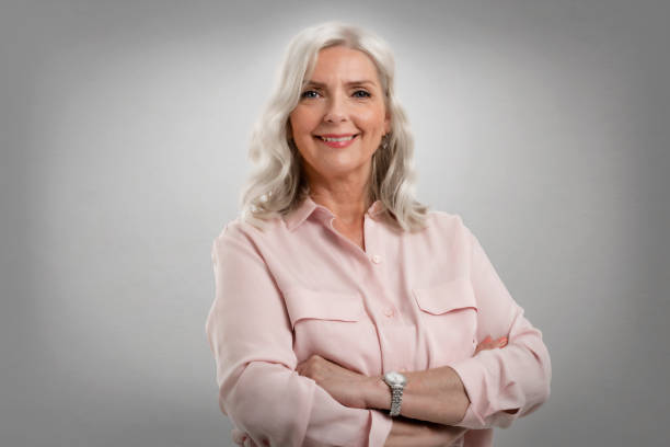istock Attractive grey haired senior woman studio portrait 1367508335