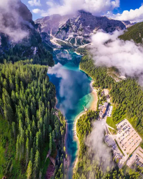 Aerial photo of the Braies Lake Pragser Wildsee with forest and water reflections
