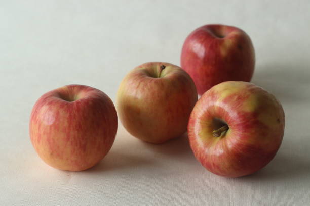 istock A crop of red fresh juicy apples, randomly placed 1367509936