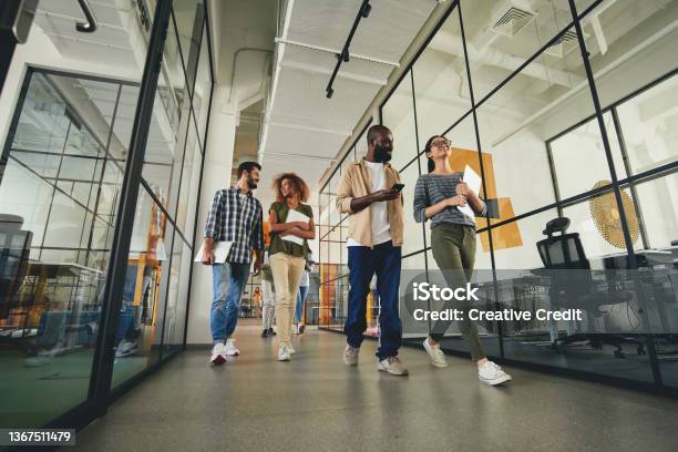 Inspired Ladies And Gentleman On Their Way To The Office Stock Photo - Download Image Now